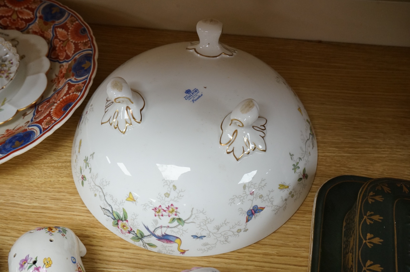 A collection of porcelain and pottery to include commemorative china, a leaf dish and group of wade figures, largest 29cm in diameter